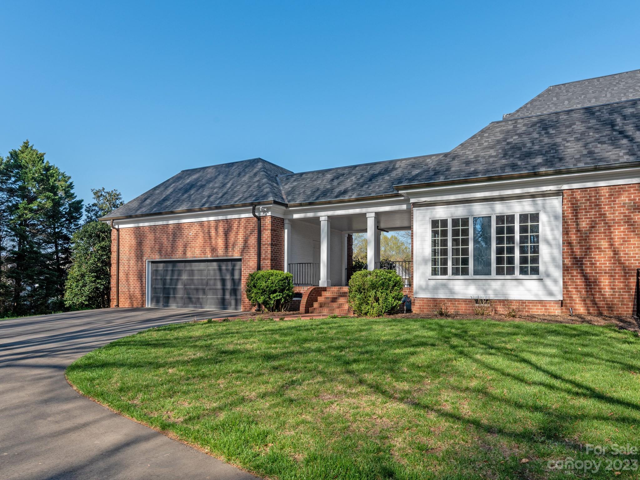1150 Concord Road Davidson, NC 28036 - Photo 25 of 39 a view of a house with a yard and pathway