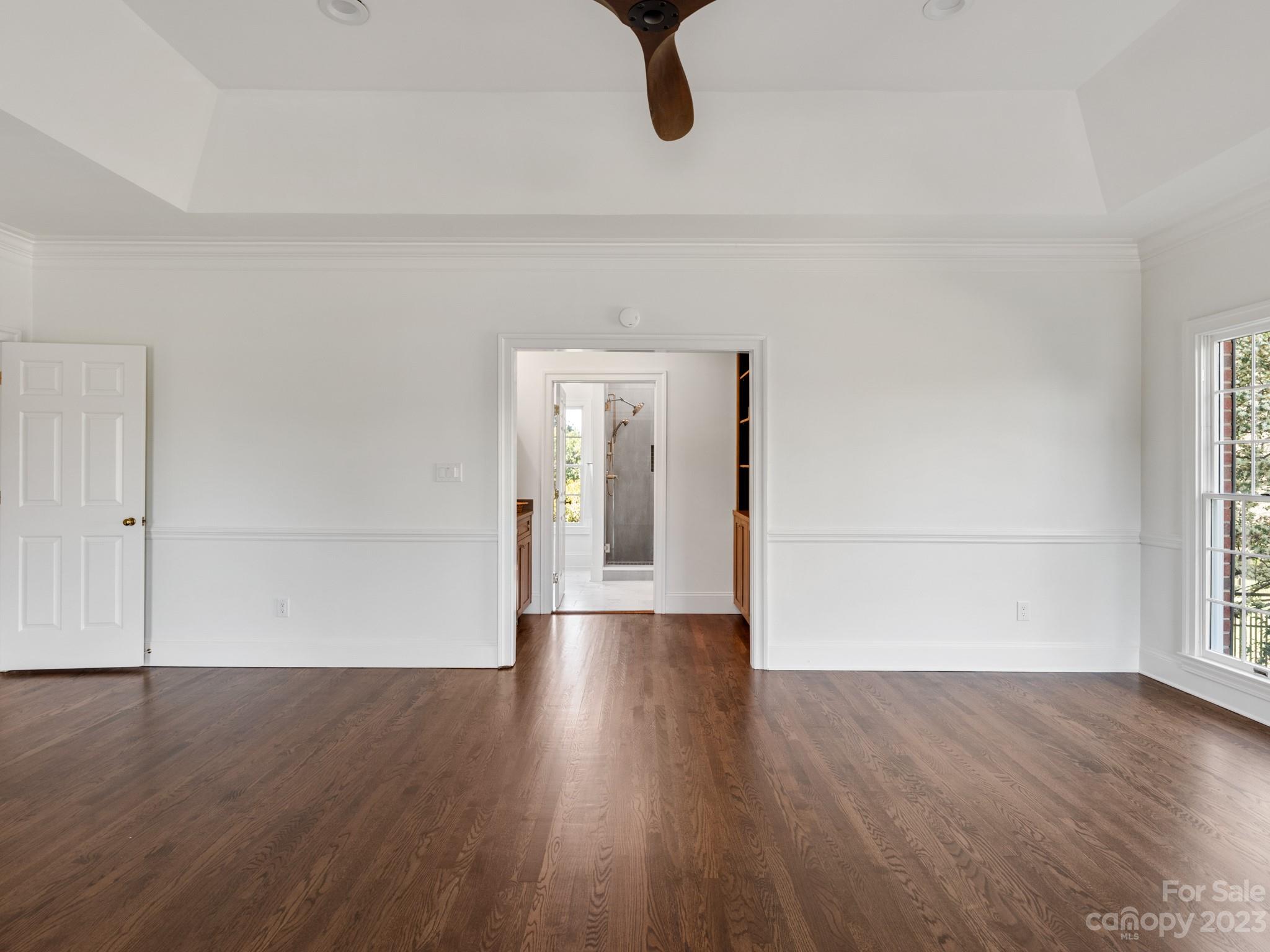 1150 Concord Road Davidson, NC 28036 - Photo 29 of 39 a view of empty room with wooden floor and fan