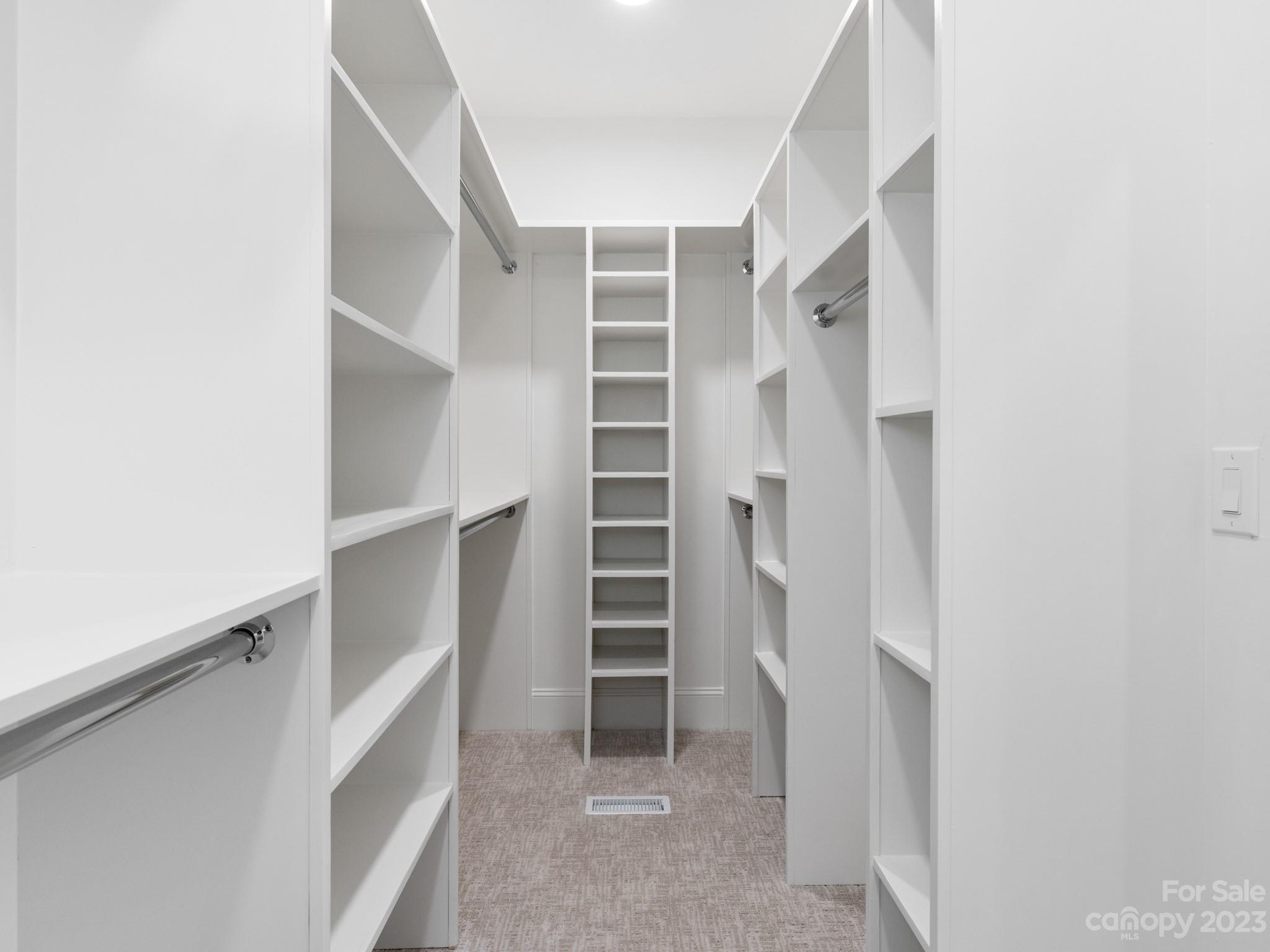 1150 Concord Road Davidson, NC 28036 - Photo 33 of 39 a view of walk in closet with empty racks