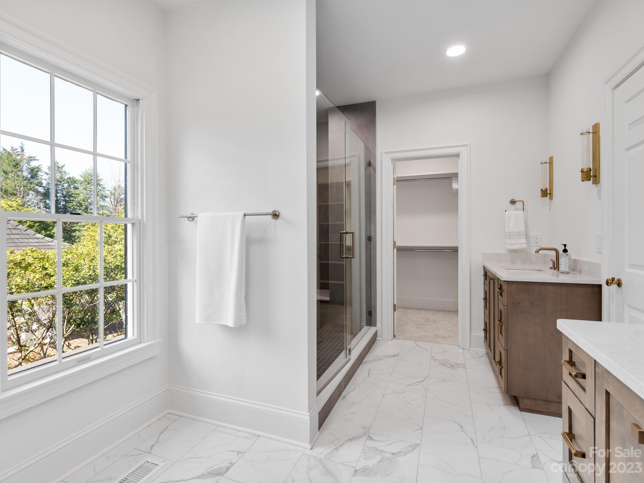 1150 Concord Road Davidson, NC 28036 - Photo 34 of 39 a view of a bathroom with a sink and a tub