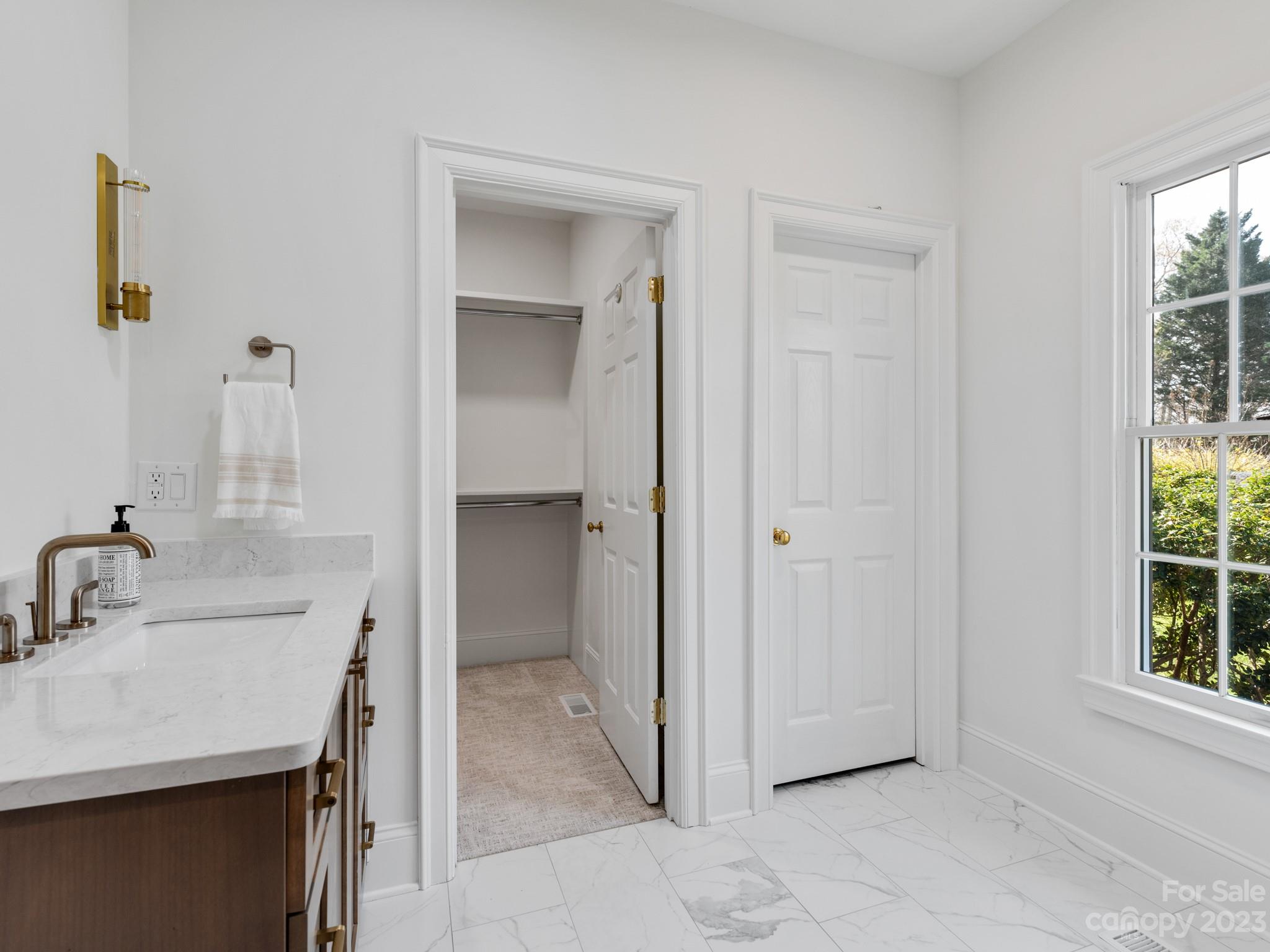 1150 Concord Road Davidson, NC 28036 - Photo 35 of 39 a bathroom with a sink and a mirror