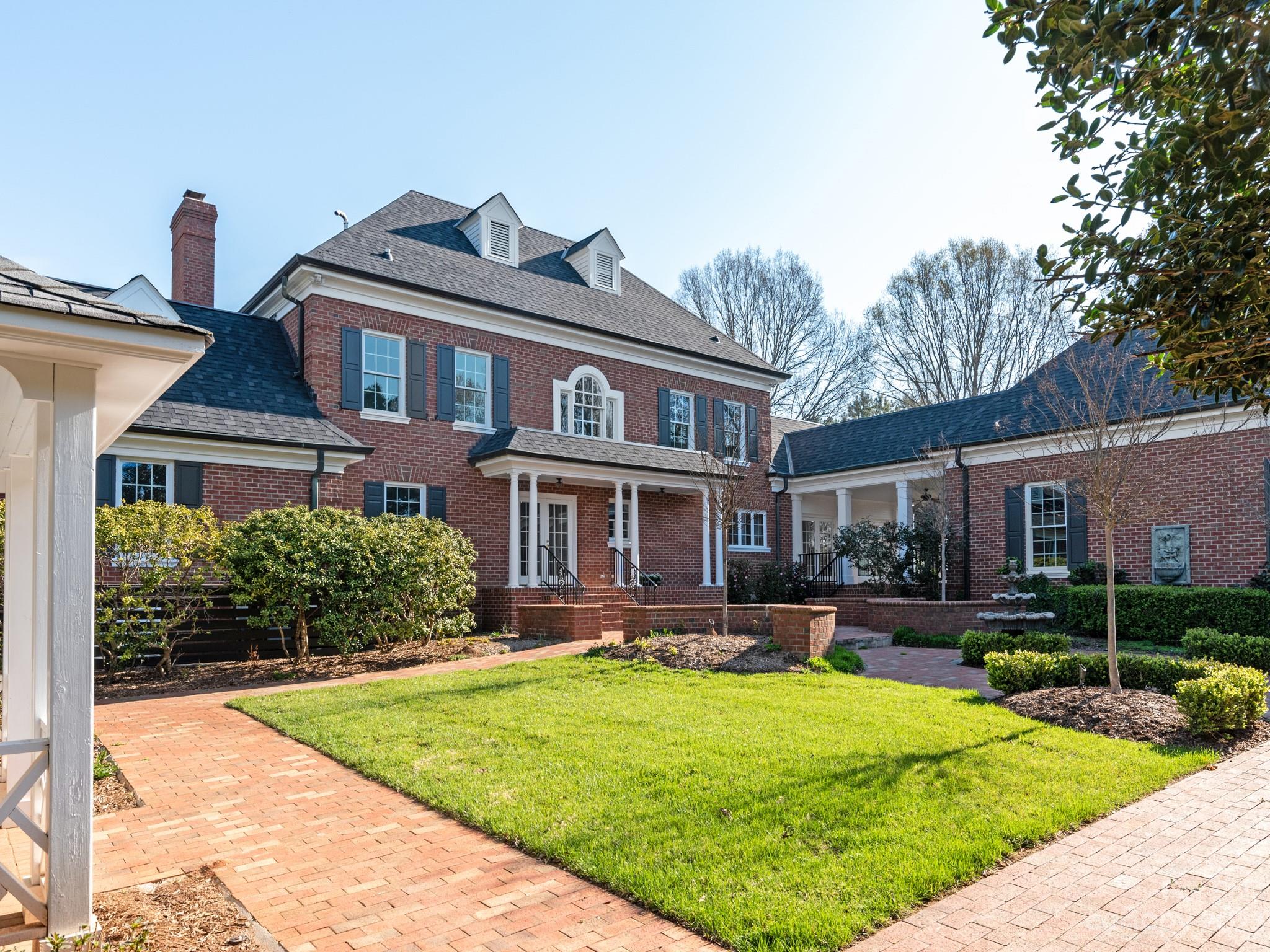 1150 Concord Road Davidson, NC 28036 - Photo 4 of 39 a front view of house with yard and green space
