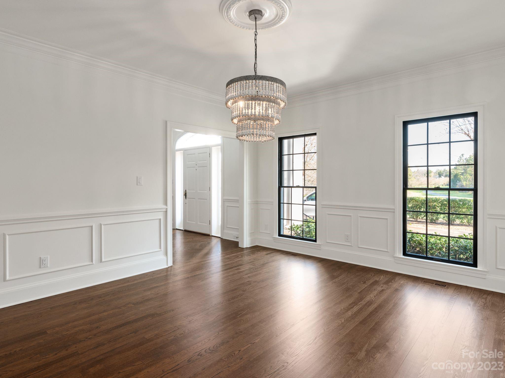 1150 Concord Road Davidson, NC 28036 - Photo 9 of 39 a view of an empty room with wooden floor and a window