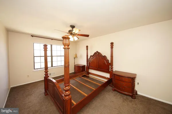 a room with gym equipment and a chandelier