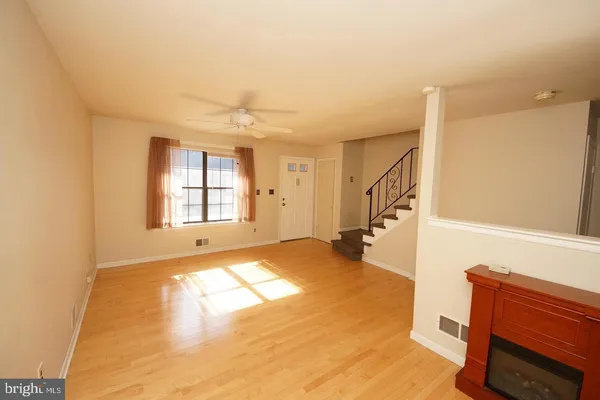 a kitchen with a refrigerator and a stove top oven