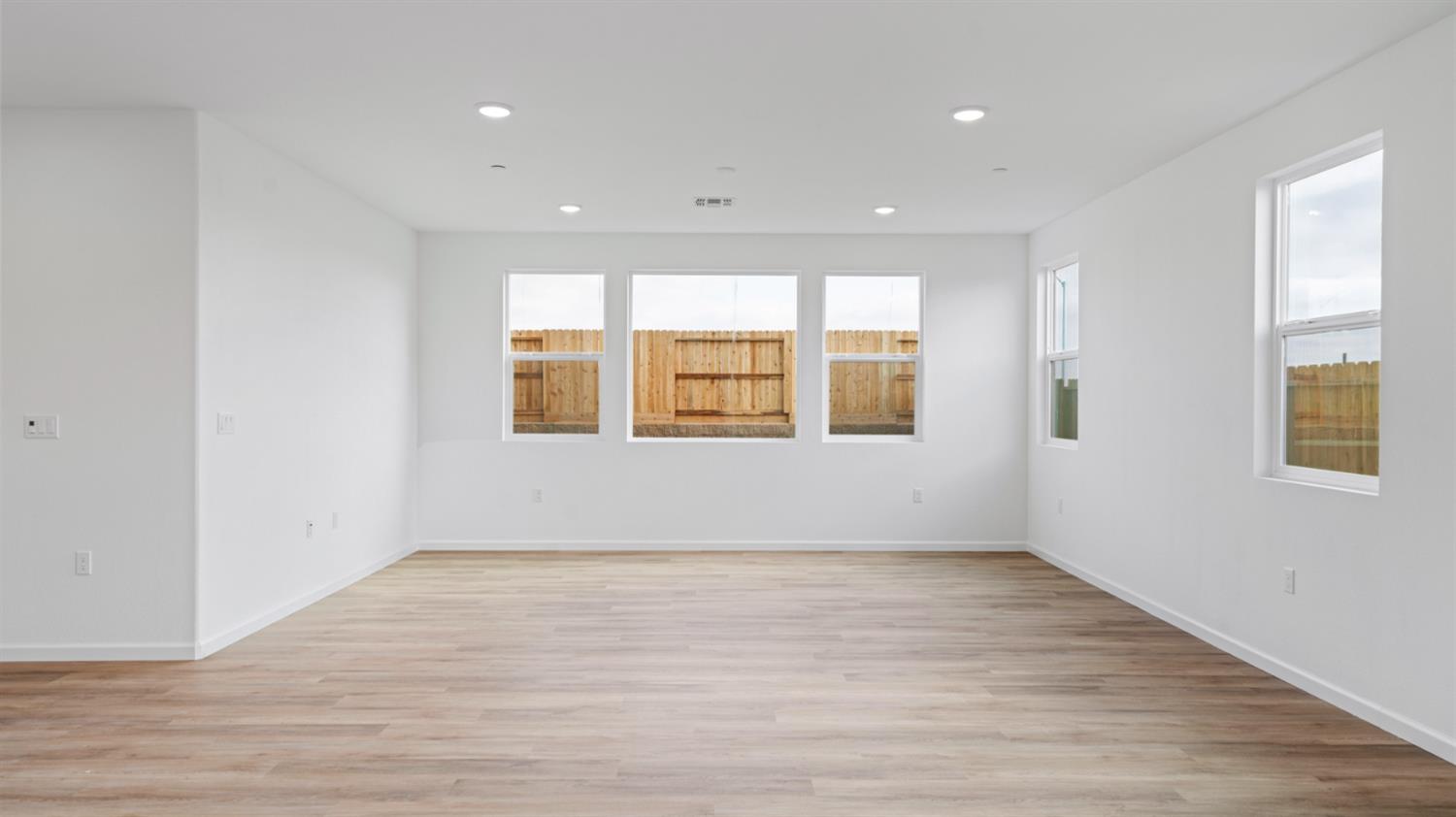 4261 Paisleyshire Way Rancho Cordova, CA 95742 - Photo 11 of 42 a view of an empty room with wooden floor and a window