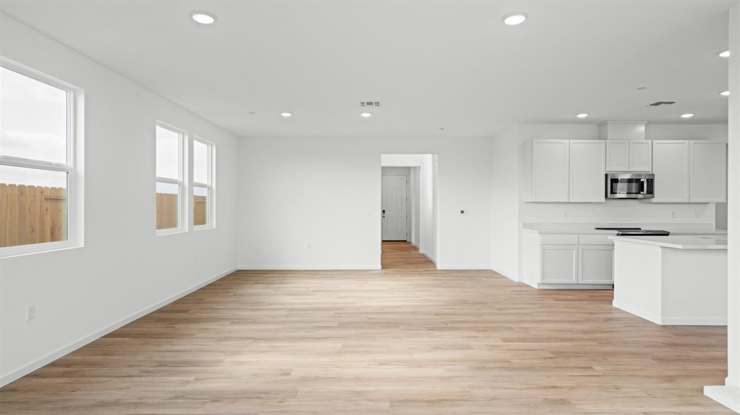 4261 Paisleyshire Way Rancho Cordova, CA 95742 - Photo 14 of 42 a view of an empty room with kitchen and window