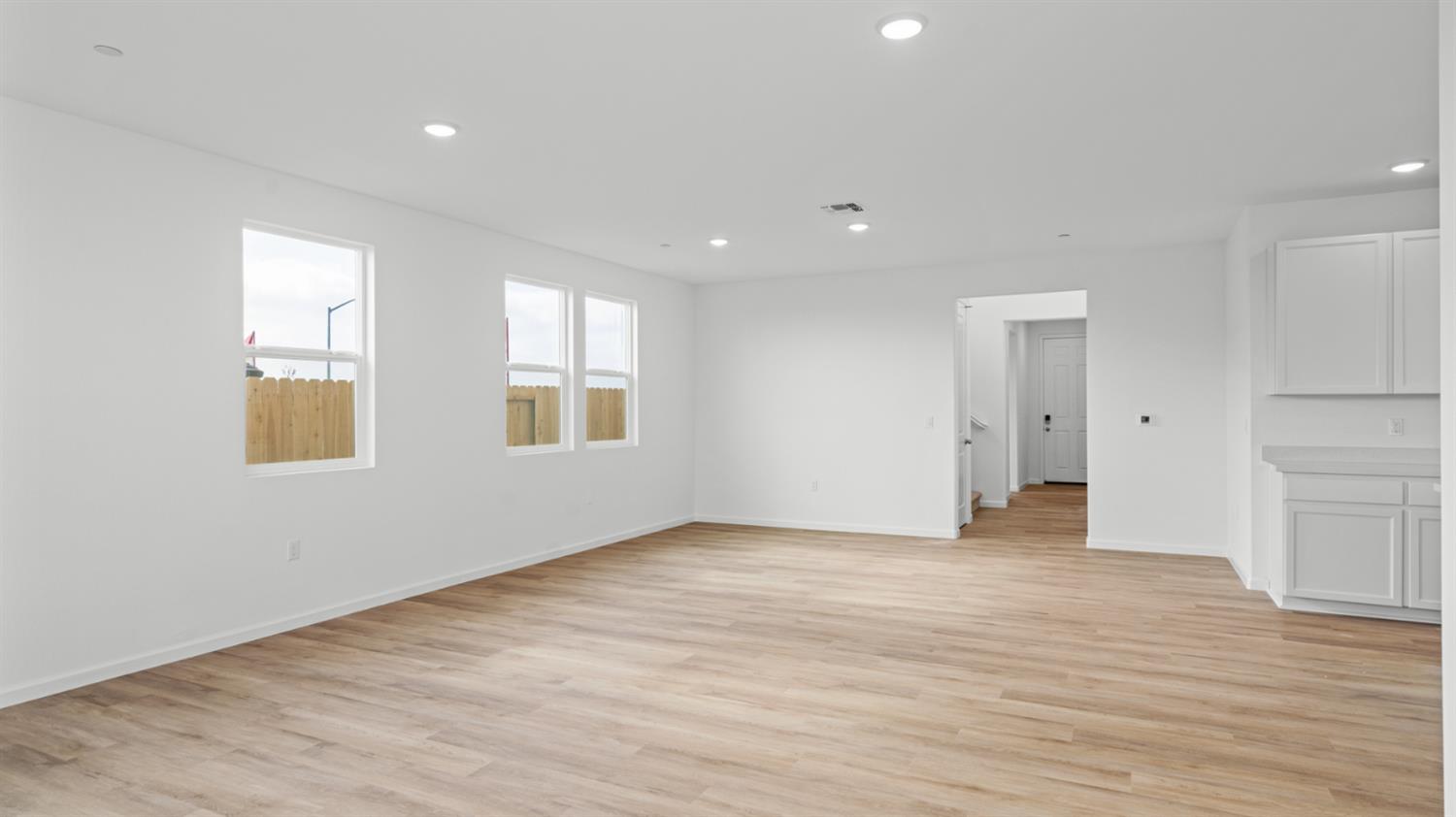 4261 Paisleyshire Way Rancho Cordova, CA 95742 - Photo 15 of 42 a view of an empty room with wooden floor and a window