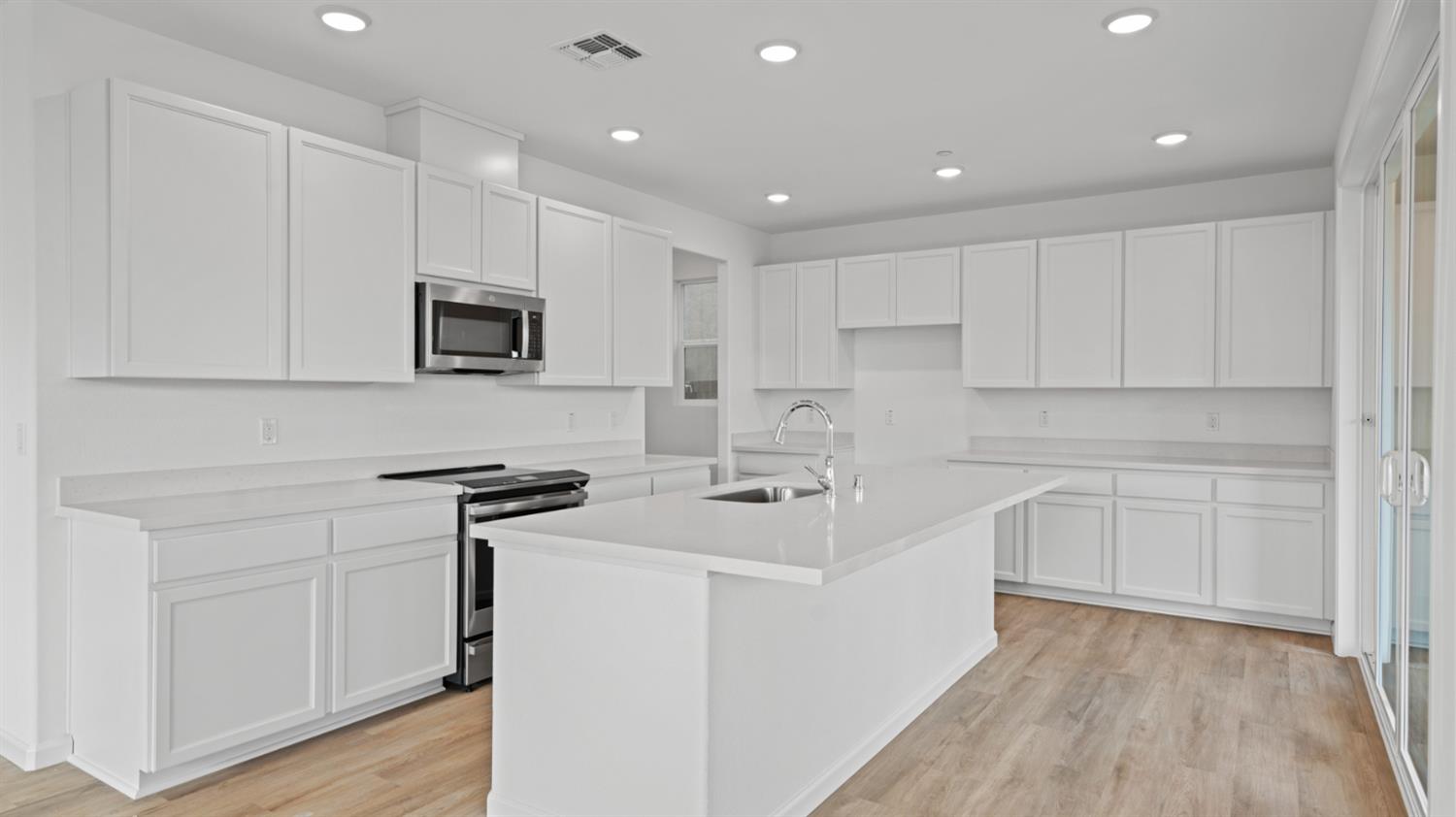 4261 Paisleyshire Way Rancho Cordova, CA 95742 - Photo 16 of 42 a kitchen with appliances a sink and cabinets