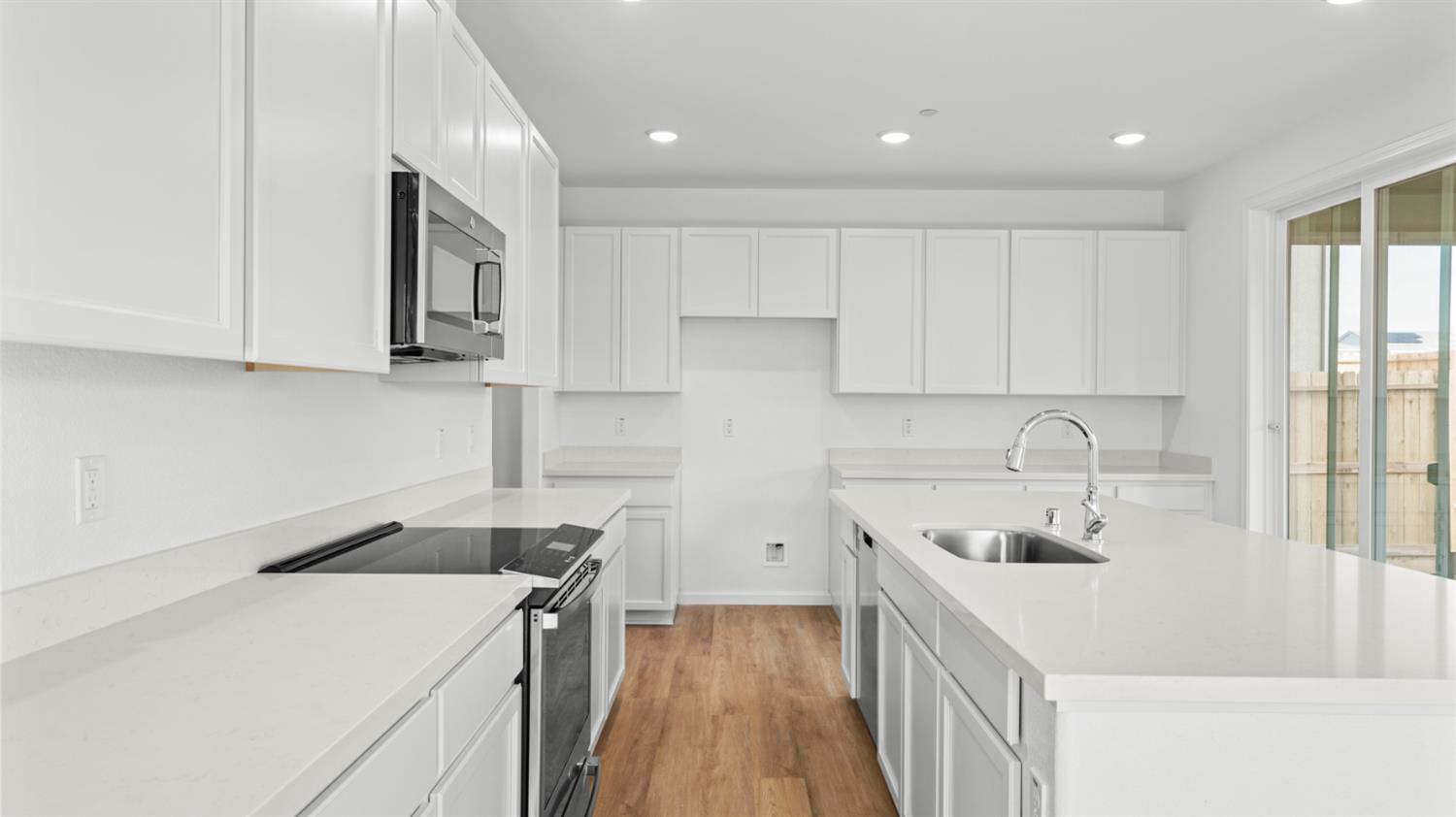 4261 Paisleyshire Way Rancho Cordova, CA 95742 - Photo 17 of 42 a kitchen that has a sink in it and white appliances