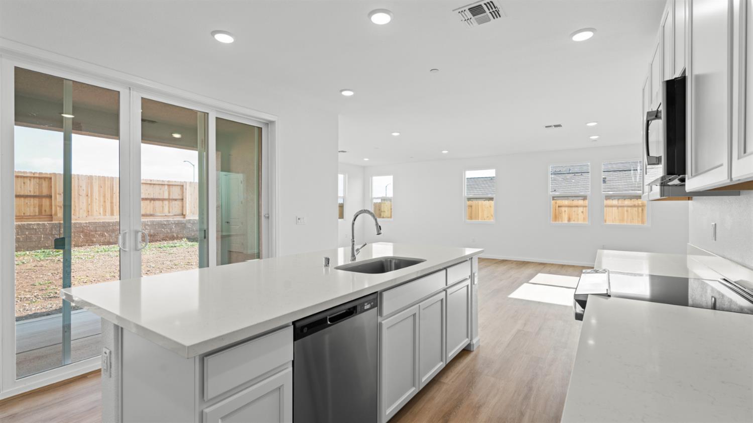 4261 Paisleyshire Way Rancho Cordova, CA 95742 - Photo 18 of 42 a kitchen with a sink and large windows