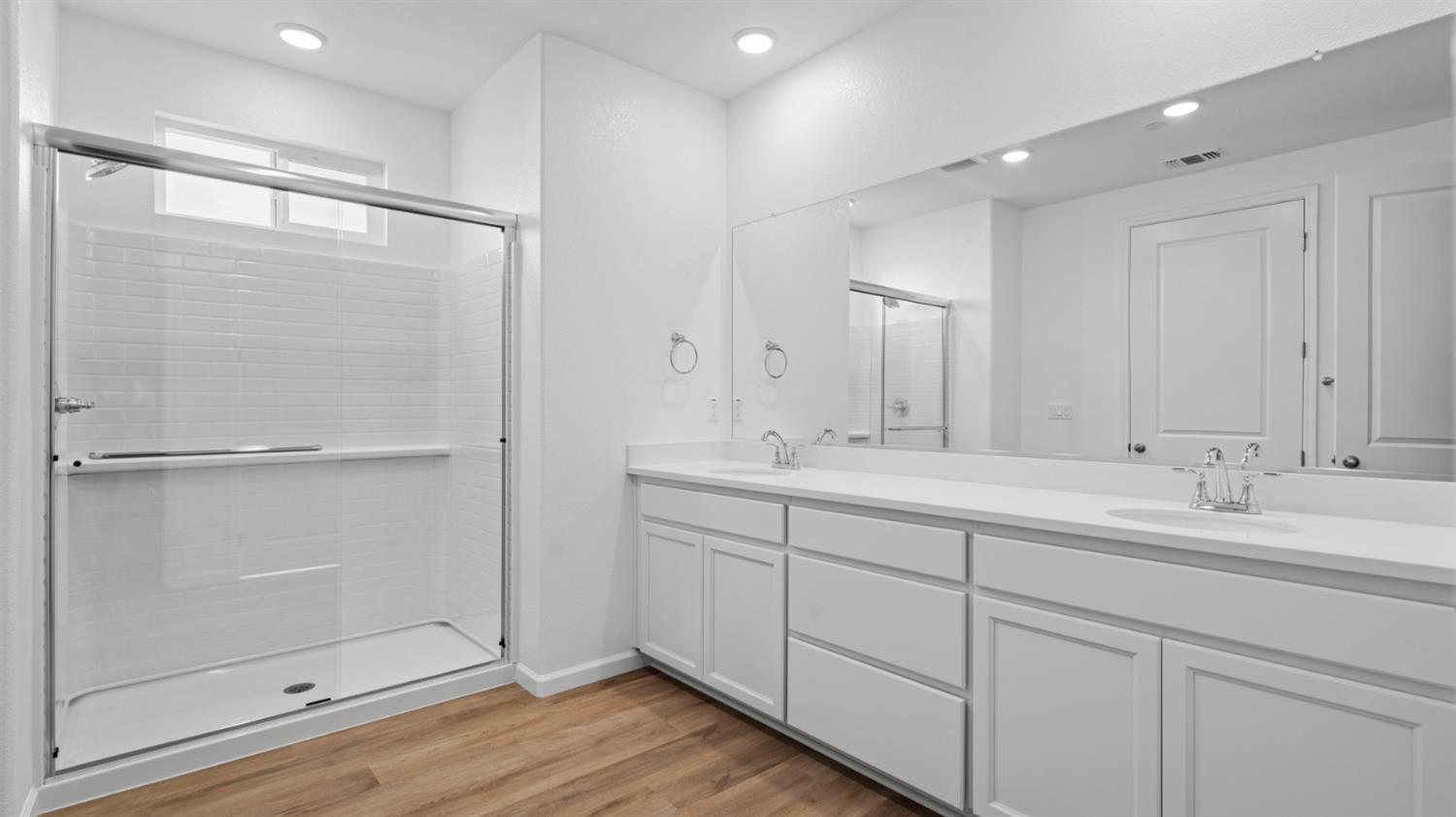 4261 Paisleyshire Way Rancho Cordova, CA 95742 - Photo 39 of 42 a bathroom with a double vanity sink mirror and shower