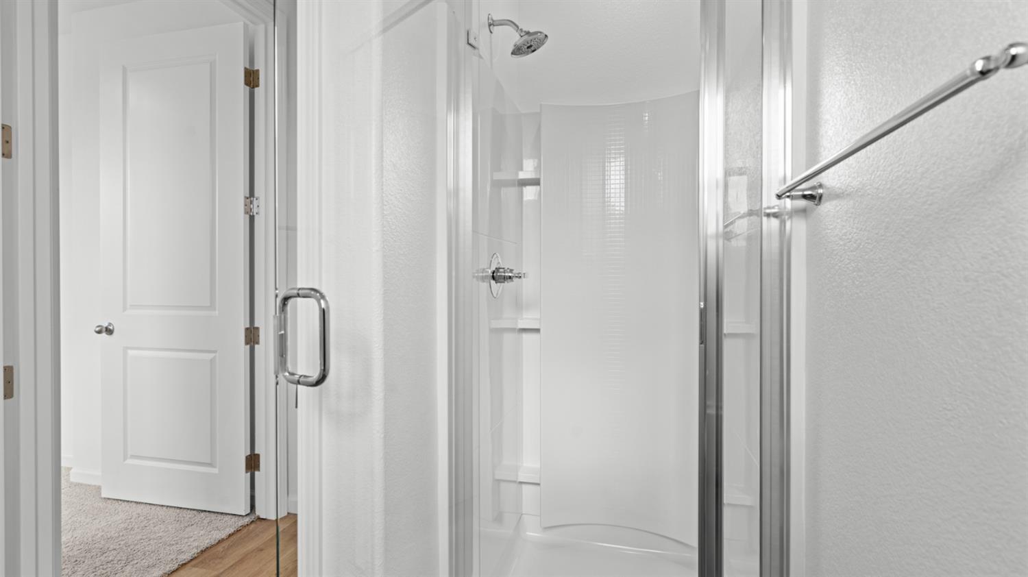 4261 Paisleyshire Way Rancho Cordova, CA 95742 - Photo 7 of 42 a bathroom with a glass shower door