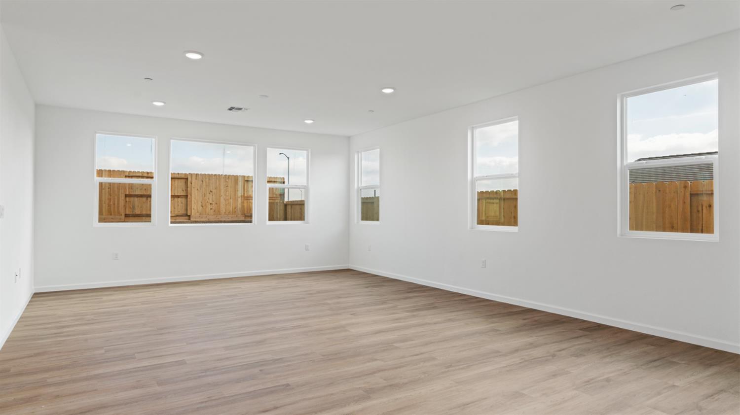 4261 Paisleyshire Way Rancho Cordova, CA 95742 - Photo 10 of 42 a view of an empty room with wooden floor and a window
