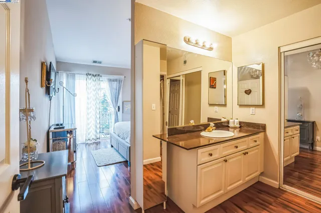 a kitchen with stainless steel appliances granite countertop a stove and a refrigerator