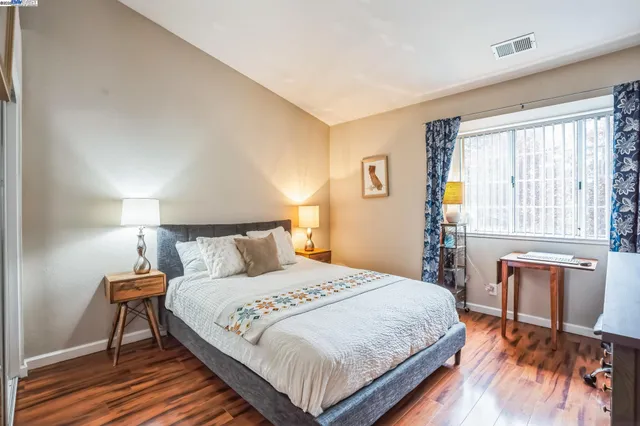 a bedroom with a bed and a fireplace