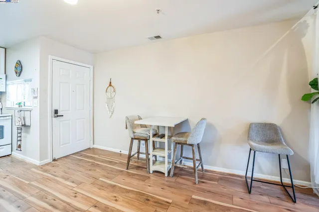 a workspace with furniture and wooden floor