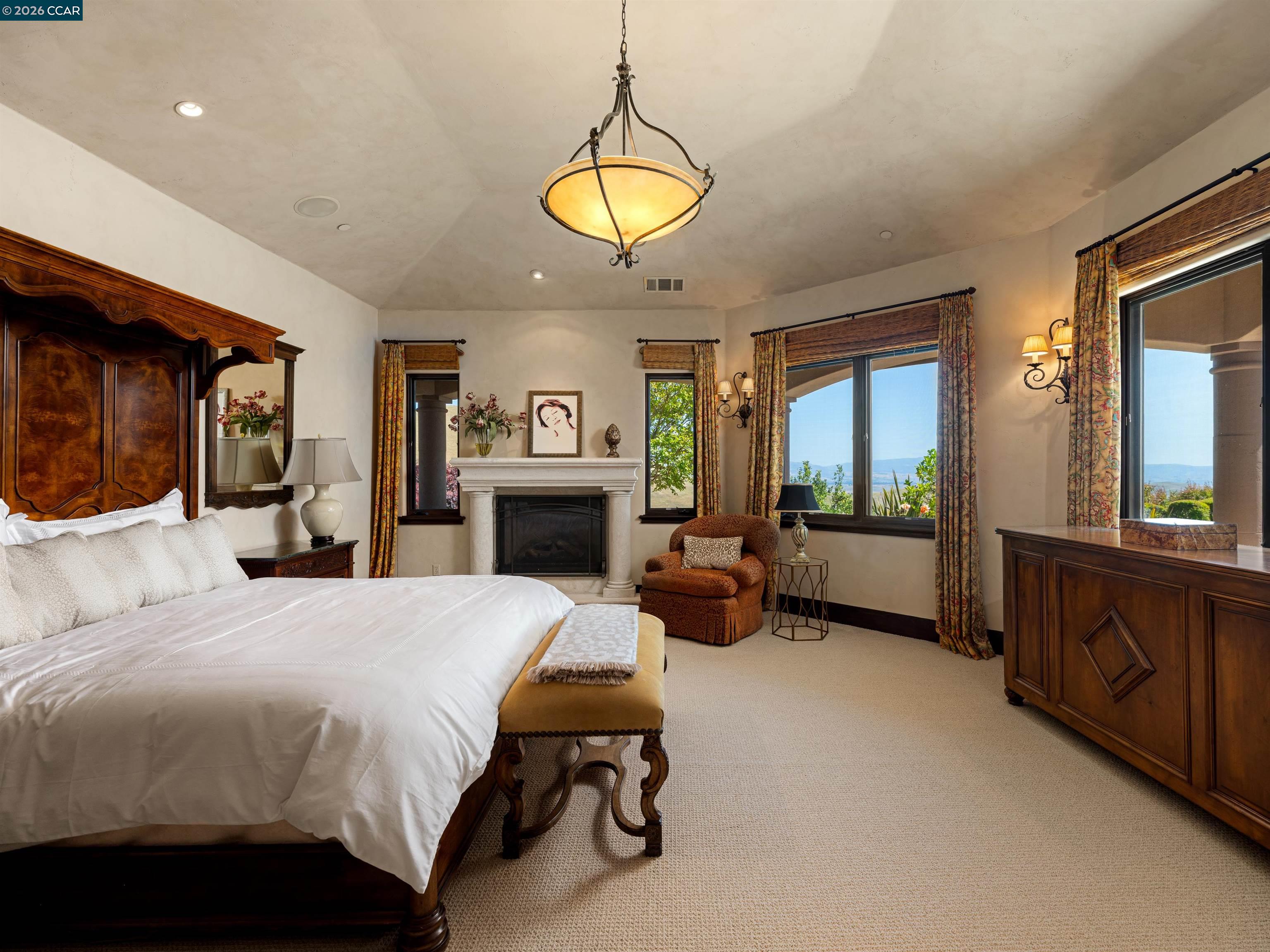 2020 Victorine Road Livermore, CA 94551 - Photo 38 of 99 a bed room with a bed and a chandelier
