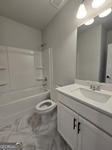 a bathroom with a sink a toilet and a bathtub
