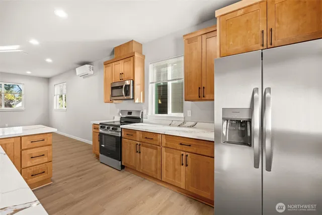 a kitchen with a sink appliances and cabinets