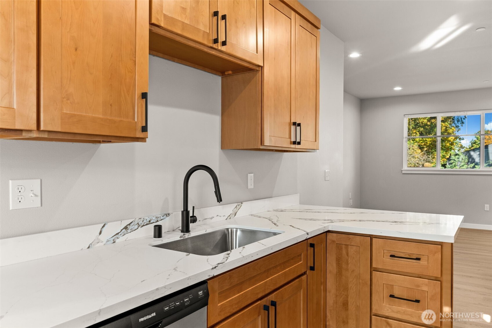 304 118th Street South, Unit 4 Tacoma, WA 98444 - Photo 13 of 37 a kitchen with a sink cabinets and a window