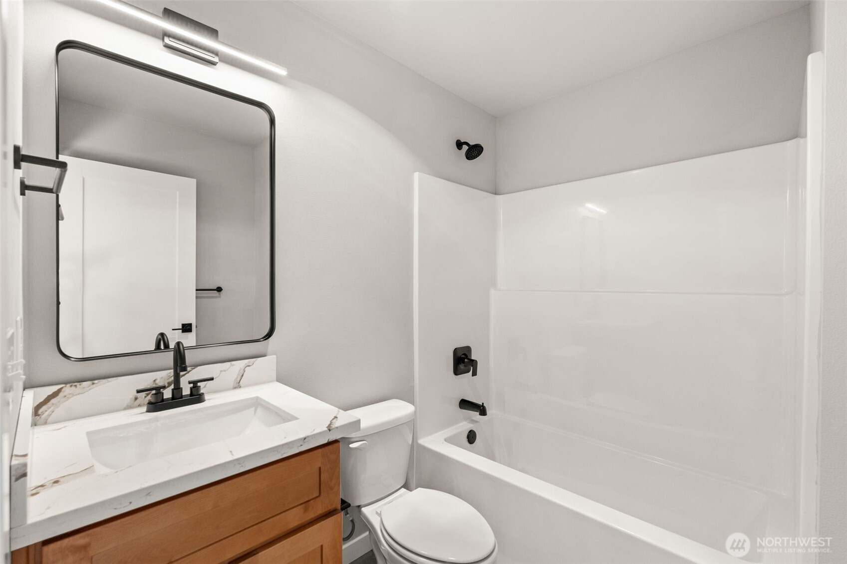 304 118th Street South, Unit 4 Tacoma, WA 98444 - Photo 23 of 37 a bathroom with a sink toilet tub and shower