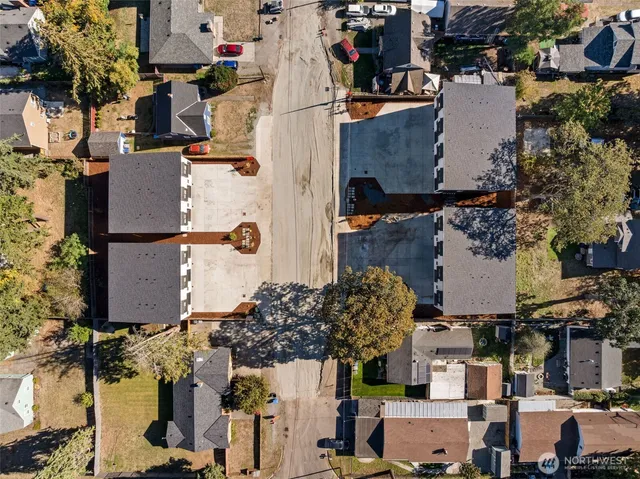 an aerial view of residential houses with outdoor space