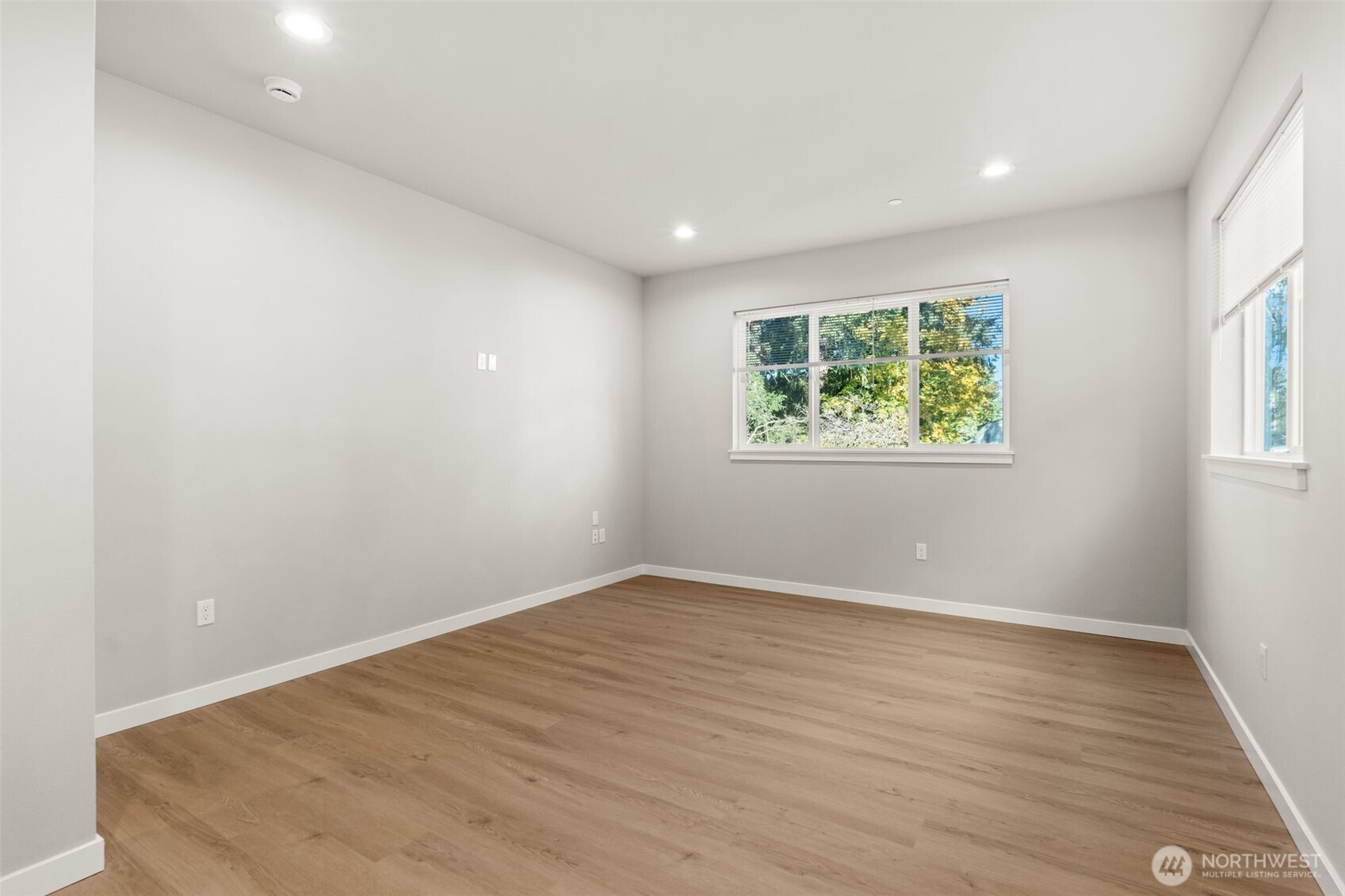304 118th Street South, Unit 4 Tacoma, WA 98444 - Photo 8 of 37 an empty room with windows