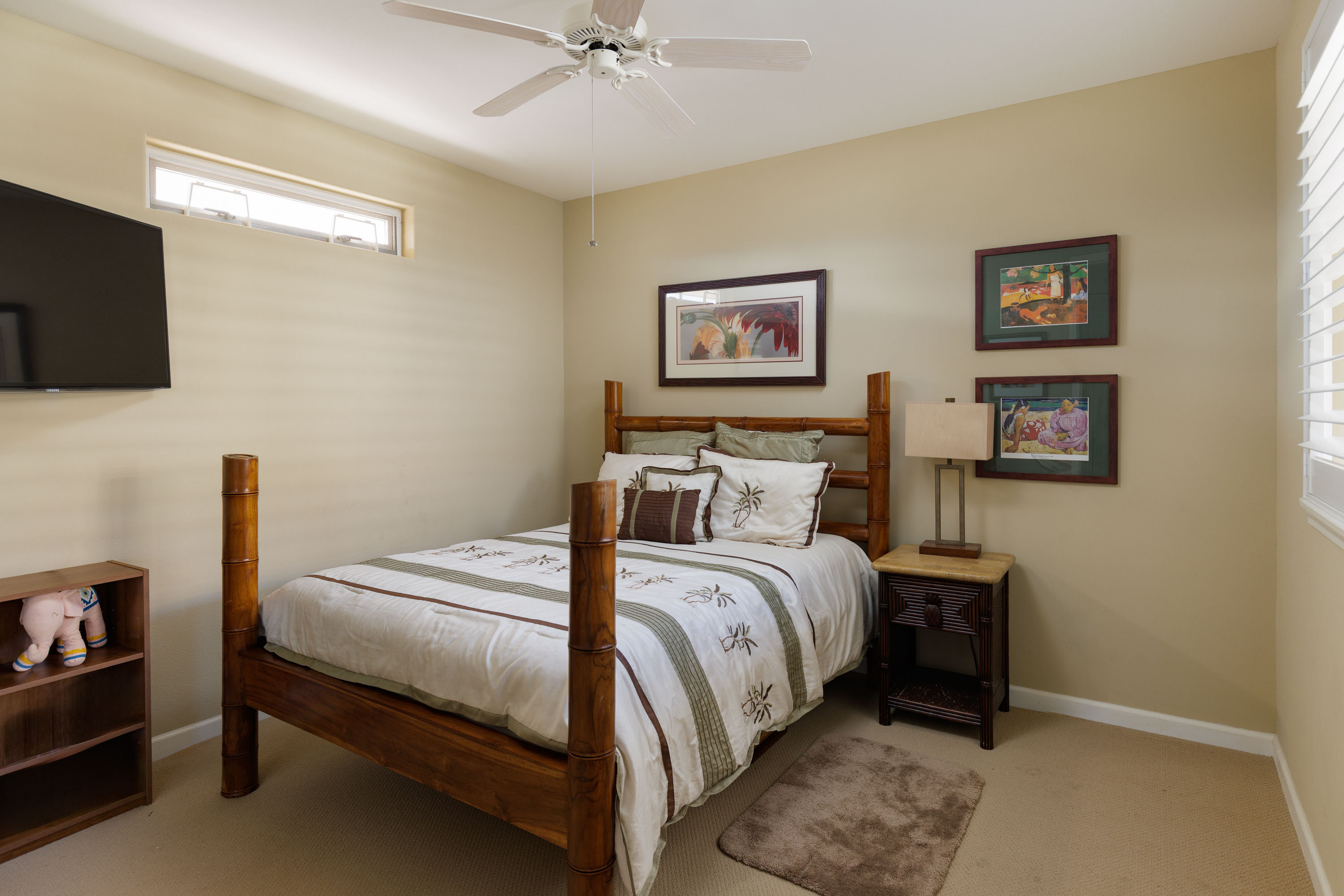 69-180 Waikoloa Beach Drive, Unit G33 Waikoloa, HI 96738 - Photo 11 of 30 a bedroom with a bed and a flat screen tv