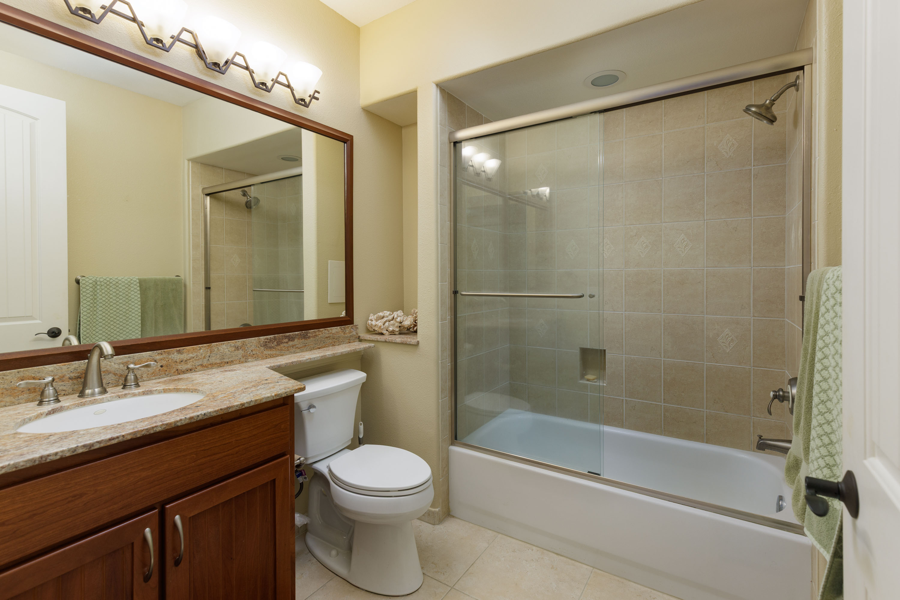 69-180 Waikoloa Beach Drive, Unit G33 Waikoloa, HI 96738 - Photo 12 of 30 a bathroom with a sink a toilet and shower