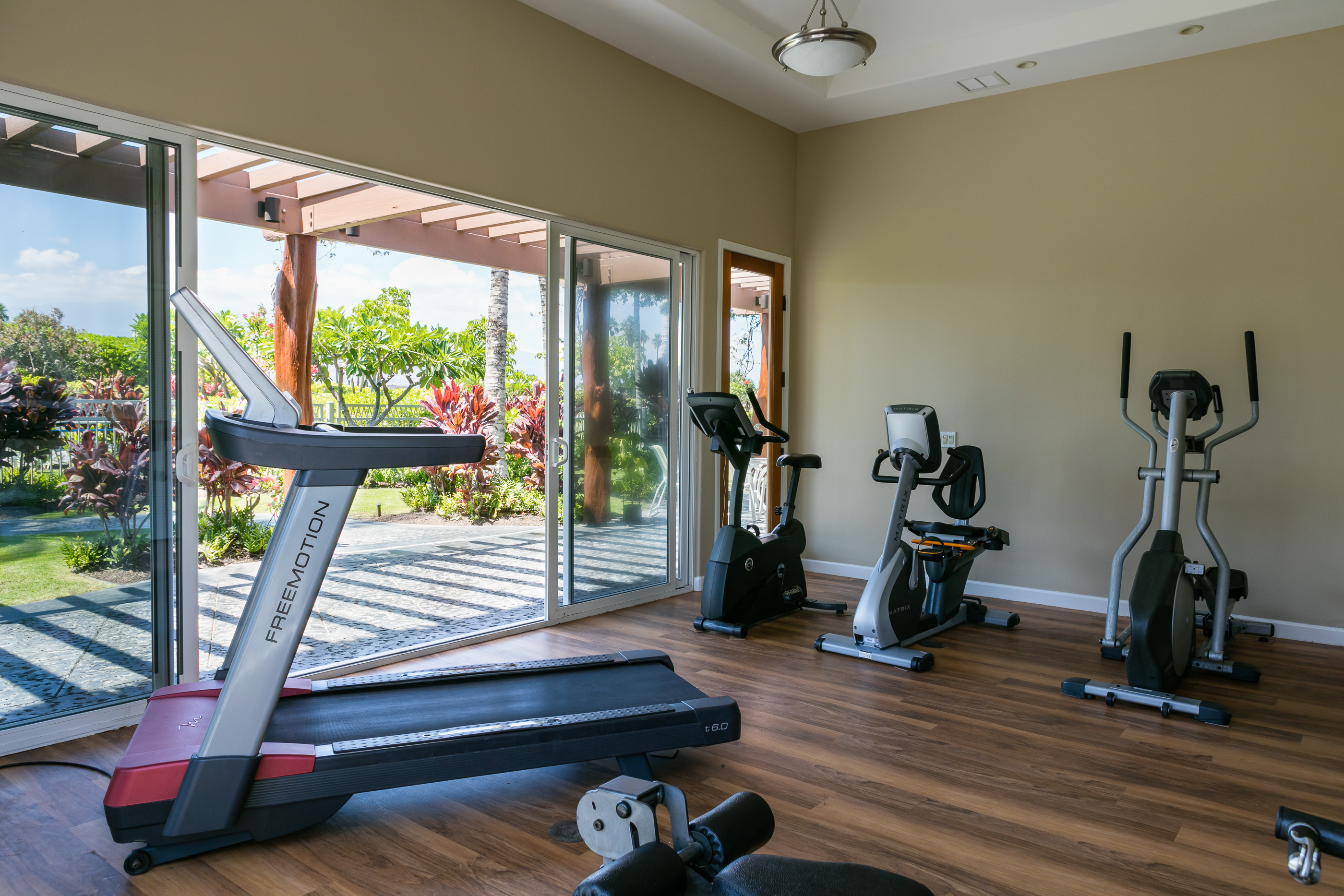 69-180 Waikoloa Beach Drive, Unit G33 Waikoloa, HI 96738 - Photo 20 of 30 a view of gym equipment with wooden floor