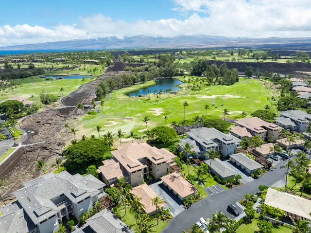 an aerial view of a houses with a lake view