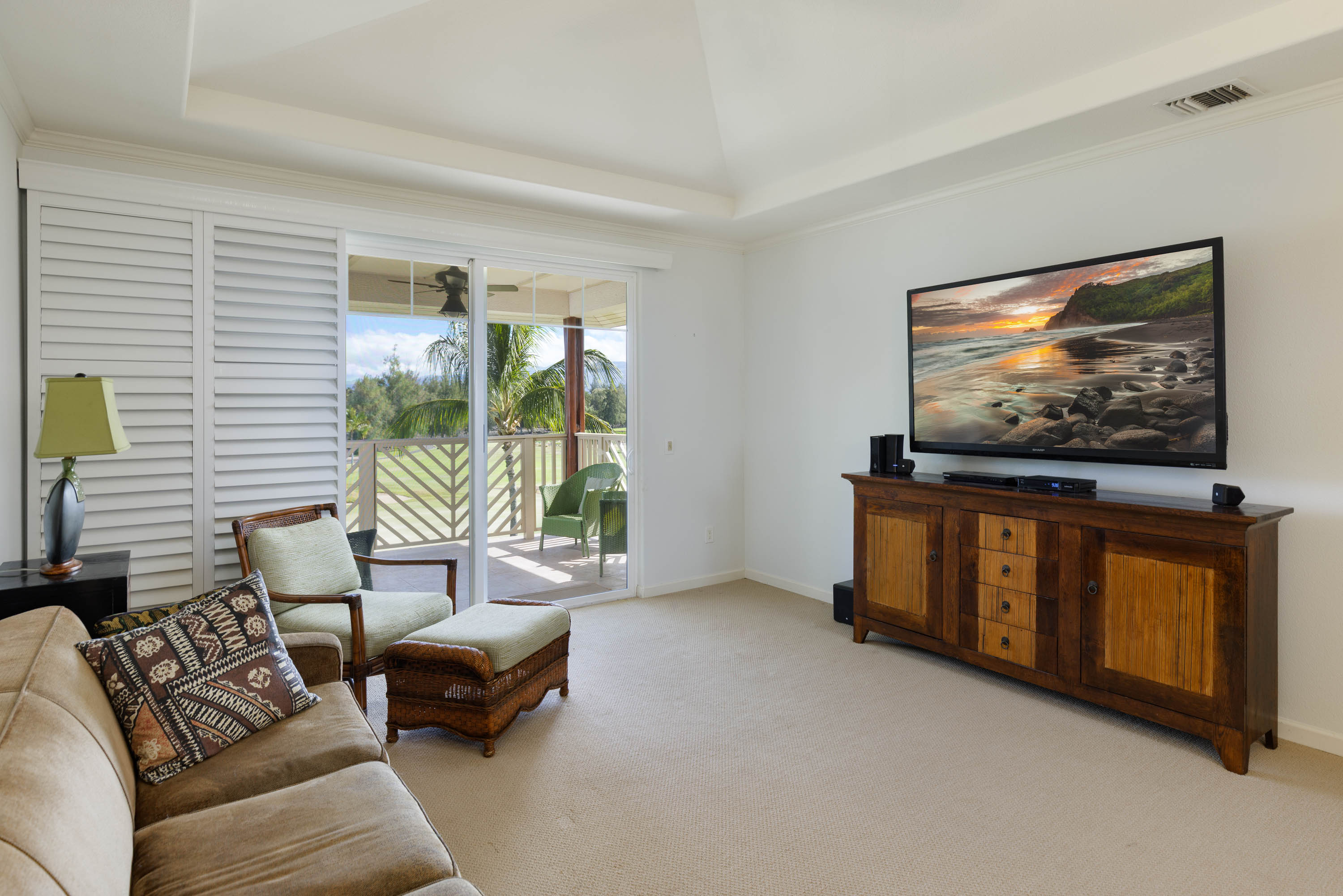 69-180 Waikoloa Beach Drive, Unit G33 Waikoloa, HI 96738 - Photo 4 of 30 a living room with furniture and a flat screen tv