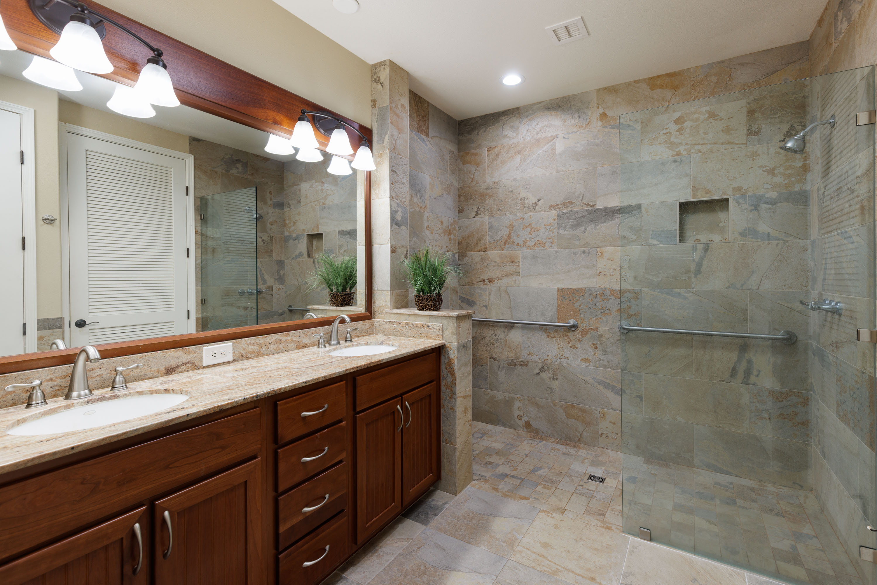 69-180 Waikoloa Beach Drive, Unit G33 Waikoloa, HI 96738 - Photo 9 of 30 a bathroom with a granite countertop sink mirror and shower