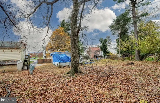 a backyard of a house with barbeque oven fire pit and outdoor seating