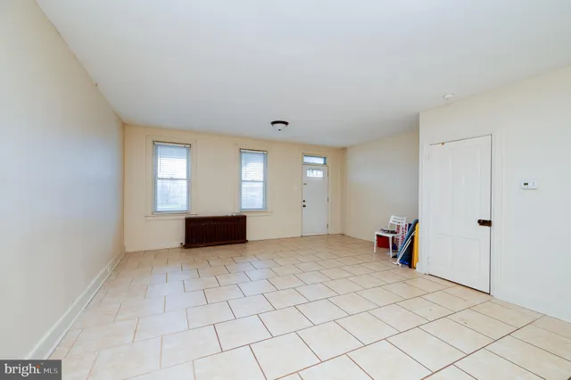 a view of empty room with a fireplace