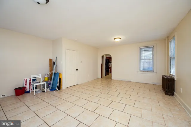 a view of a livingroom with furniture and a window