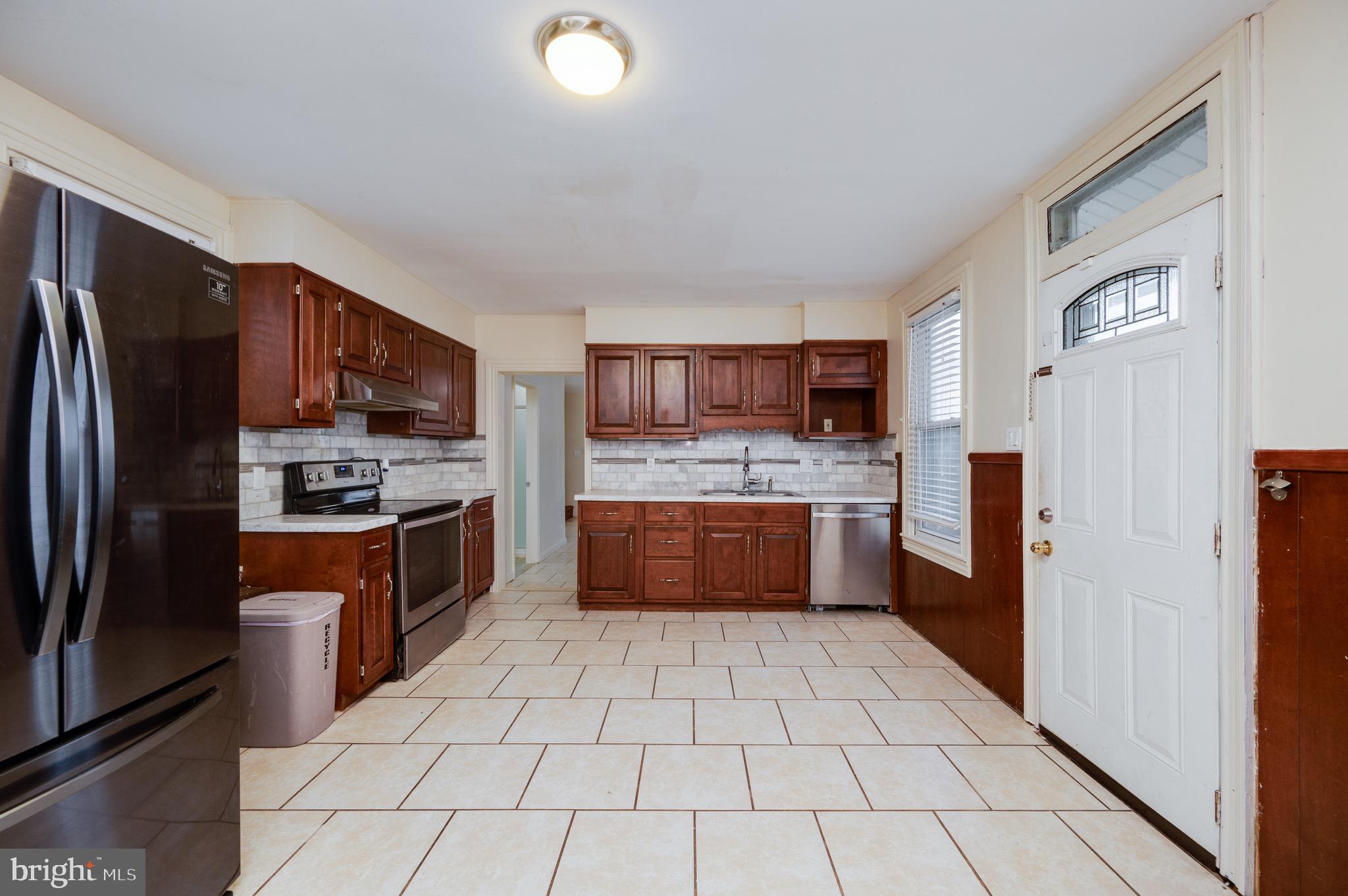 3019 Kutztown Road Reading, PA 19605 - Photo 22 of 52 a large kitchen with a large counter top stainless steel appliances and cabinets