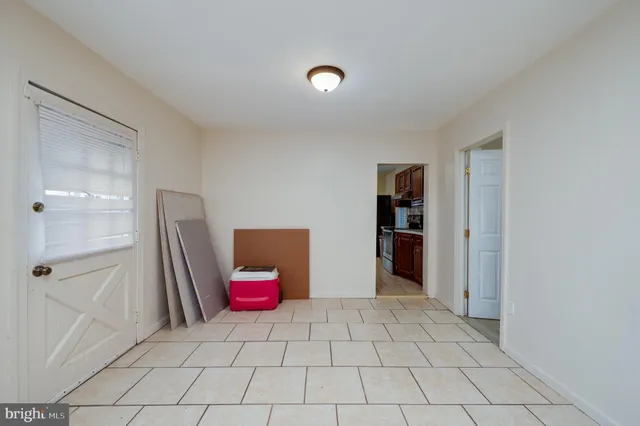 a view of a livingroom with an empty space and a fireplace