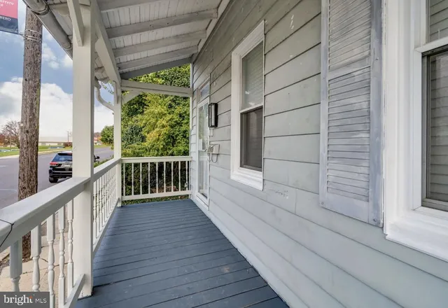 a view of a balcony with wooden floor
