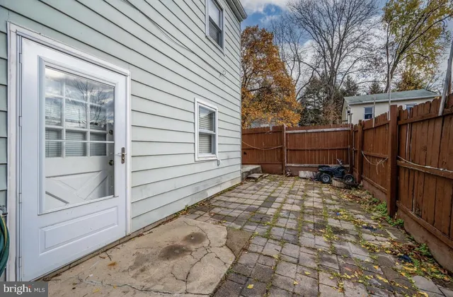 a view of a backyard with a large tree