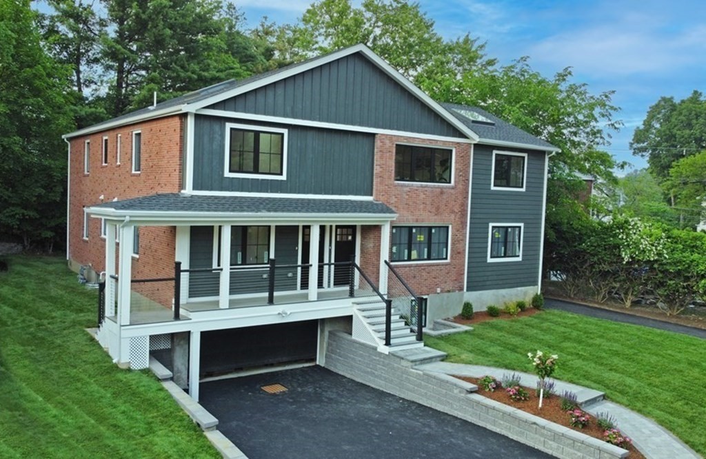9-11 Glazer Road, Unit 11 Newton, MA 02459 - Photo 1 of 31 a front view of a house with a yard