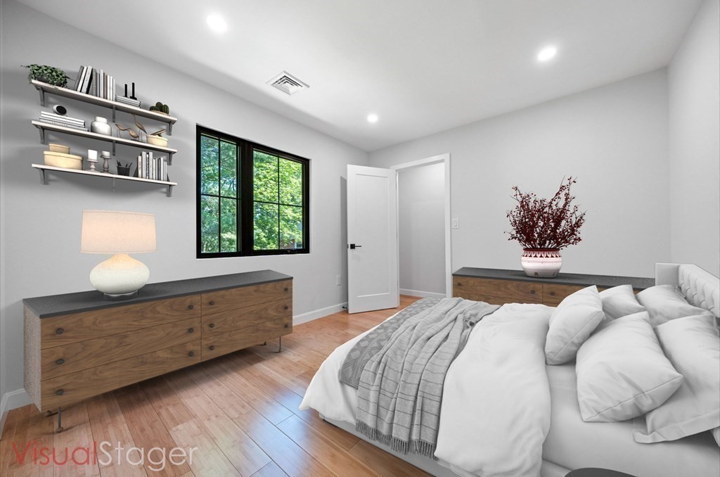 9-11 Glazer Road, Unit 11 Newton, MA 02459 - Photo 29 of 31 a bedroom with a bed and window
