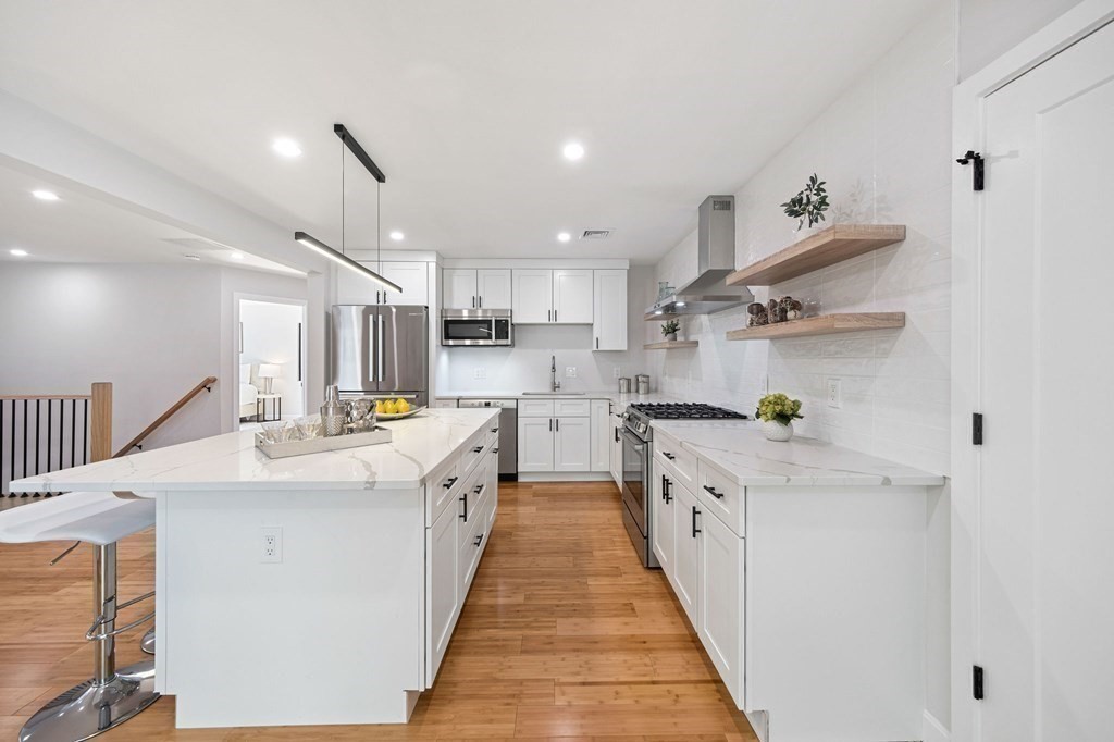 9-11 Glazer Road, Unit 11 Newton, MA 02459 - Photo 10 of 31 a kitchen with cabinets a sink and appliances