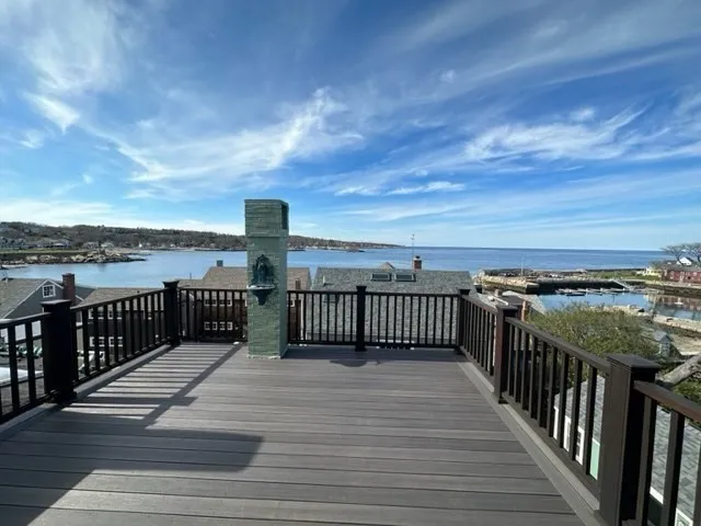 a view of a balcony with wooden floor