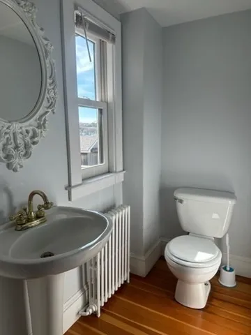 a view of a balcony with wooden fence