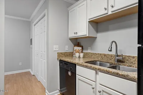 a kitchen with a sink and cabinets