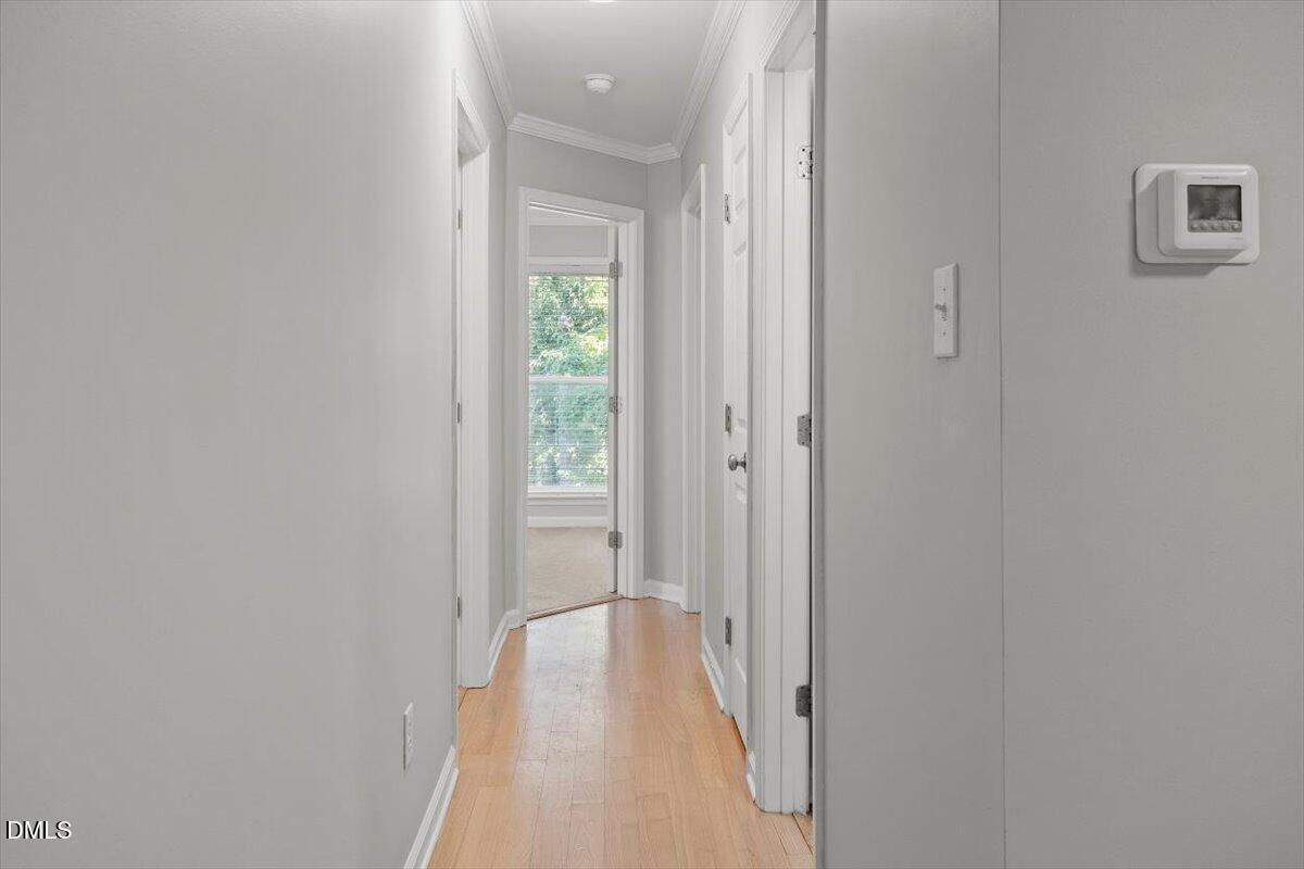 2308 Myron Drive, Unit 201 Raleigh, NC 27607 - Photo 14 of 29 a view of a hallway with a wooden floor