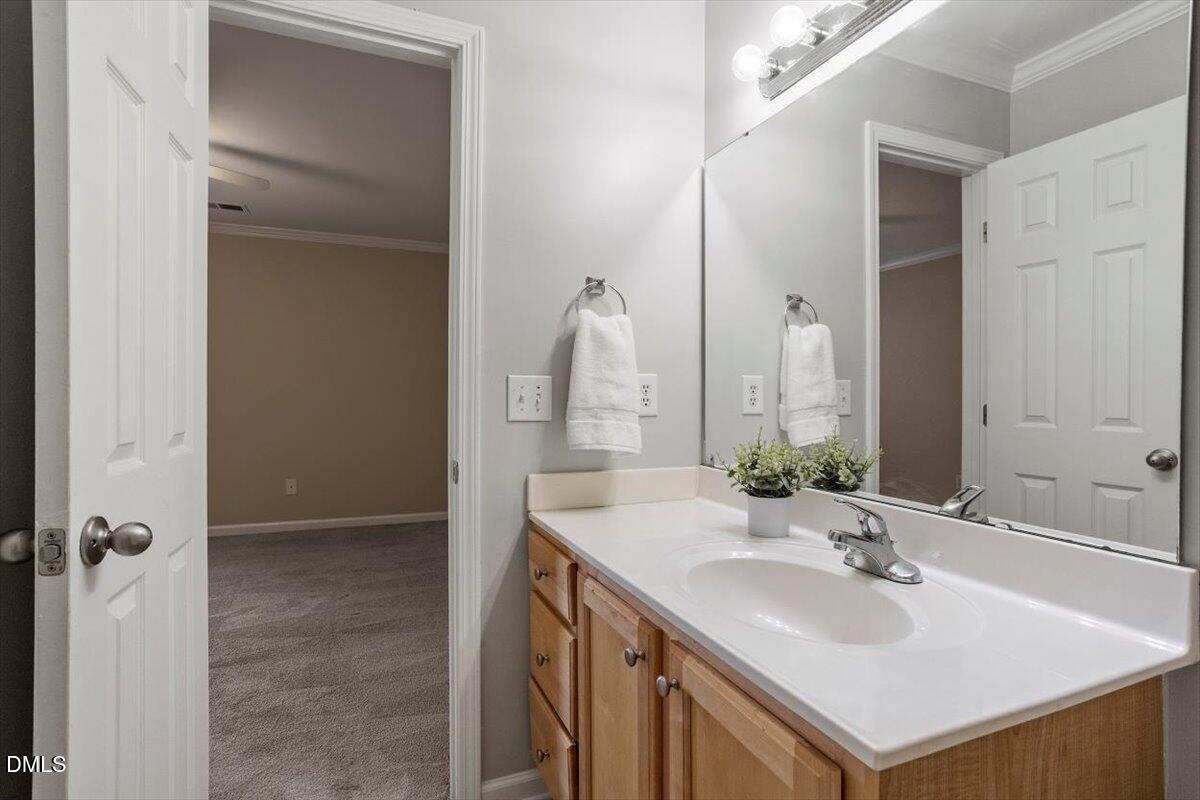 2308 Myron Drive, Unit 201 Raleigh, NC 27607 - Photo 25 of 29 a bathroom with a sink and a mirror