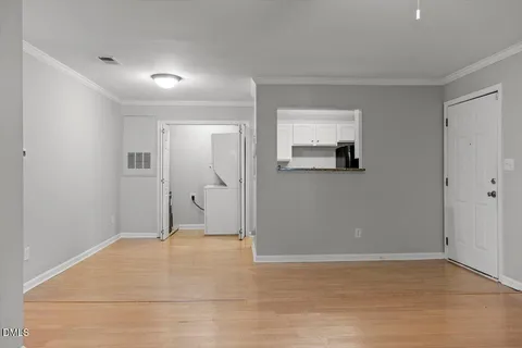 wooden floor in a room with a mirror